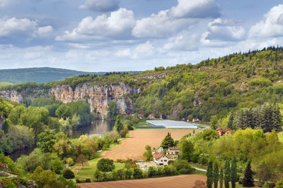 Scenic view of landscape and trees against sky