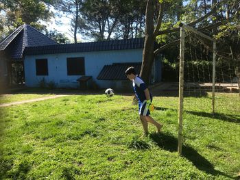 Full length of boy on field