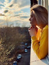 Side view of young woman looking away