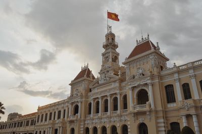 Low angle view of ho chi minh city hall against sky