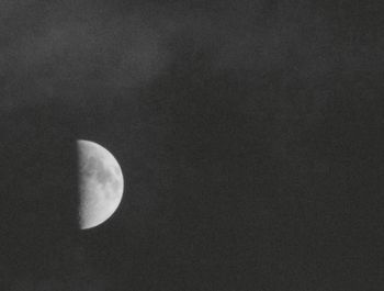 Low angle view of moon against sky at night