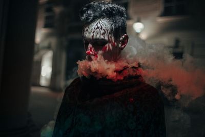 Close-up of person standing against wall during halloween