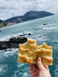 Close-up of focaccia over sea