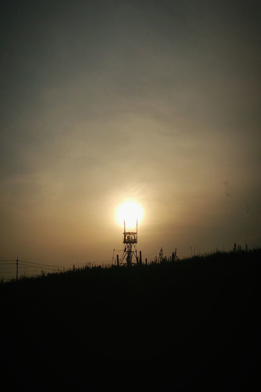 sunset, silhouette, sun, tranquility, tranquil scene, landscape, scenics, beauty in nature, sky, copy space, field, nature, orange color, idyllic, clear sky, sunlight, horizon over land, electricity pylon, outdoors, non-urban scene