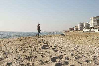 Woman standing on beach