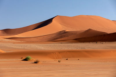 Scenic view of desert against clear sky