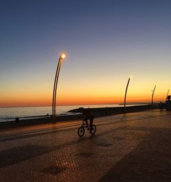 Scenic view of sea against sky at sunset