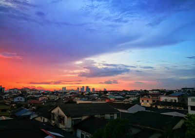 High angle view of buildings against sky during sunset
