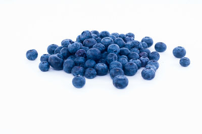 Close-up of grapes against white background