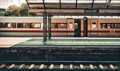 Railroad station platform seen through train window