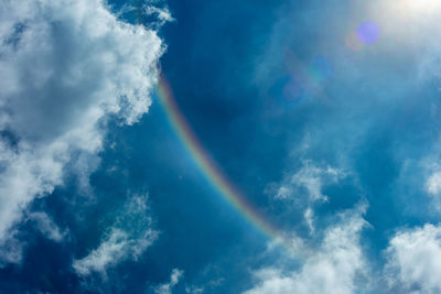 Low angle view of rainbow in sky