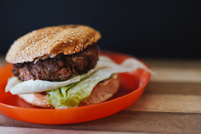 Close-up of burger in plate on table