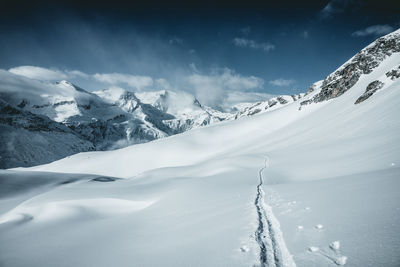 Ski tracks in alpine winter wonderland landscape, austrian alps, gastein, salzburg, austria