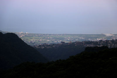 High angle view of buildings in city against sky