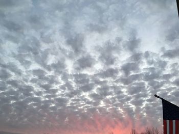 Low angle view of cloudy sky at sunset