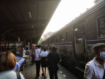 People waiting at railroad station platform