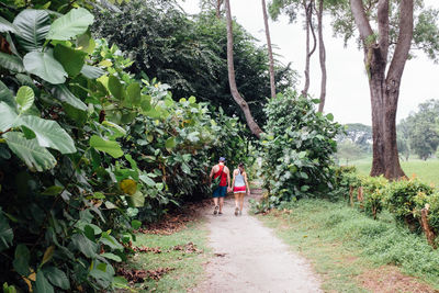 Full length of people walking on footpath