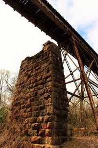 Low angle view of abandoned built structure