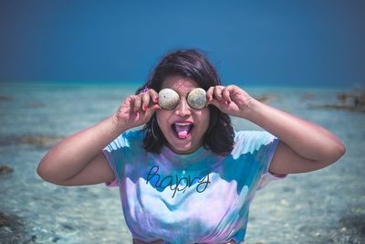 Portrait of a girl wearing shell sunglasses