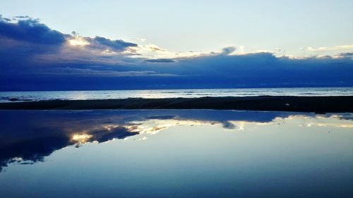 Scenic view of sea against sky at sunset