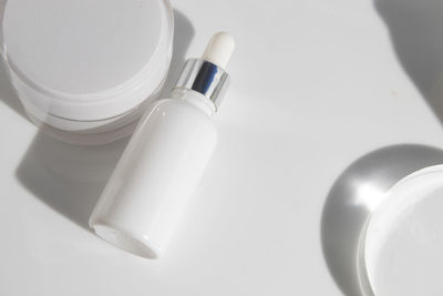 High angle view of bottles on white background