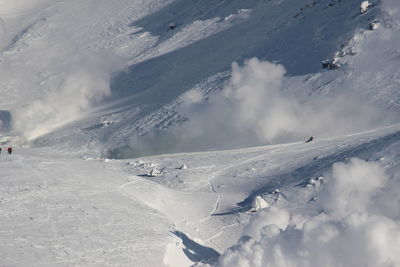 Scenic view of snow covered land