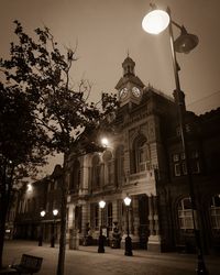 Low angle view of building lit up at night