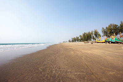 Scenic view of beach against clear sky