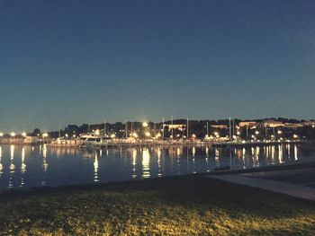 Reflection of illuminated buildings in water