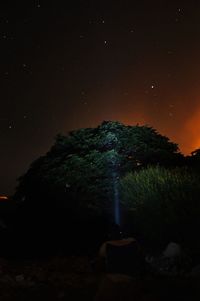 Scenic view of illuminated mountain against sky at night