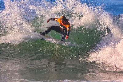 Man splashing water in sea