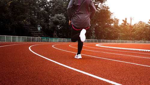 Full length rear view of man running