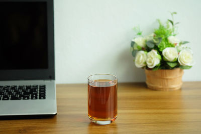 Glass of white wine on table