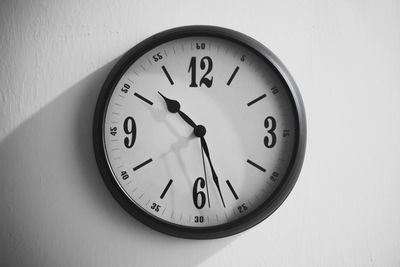 Close-up of clock on wall