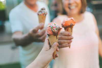 Cropped image of hand holding ice cream