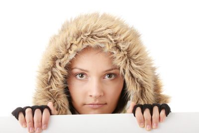 Portrait of teenage girl against white background