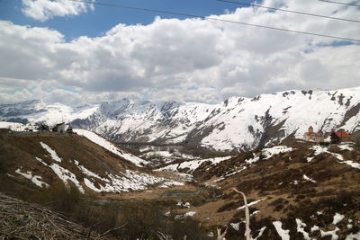 Scenic view of snowcapped mountains against sky