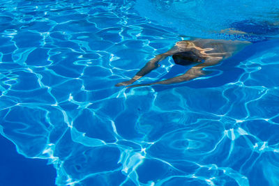 High angle view of man swimming in pool