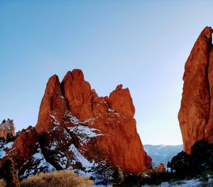 Rock formations on landscape against clear sky