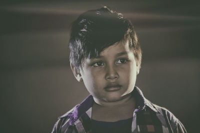 Close-up of thoughtful boy looking away