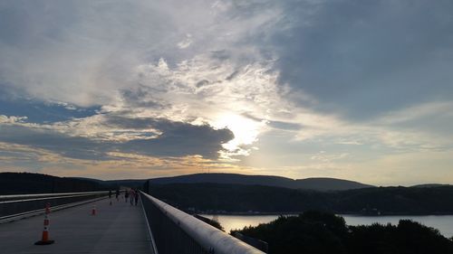 Scenic view of river against sky during sunset