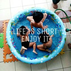 High angle view of children playing in swimming pool