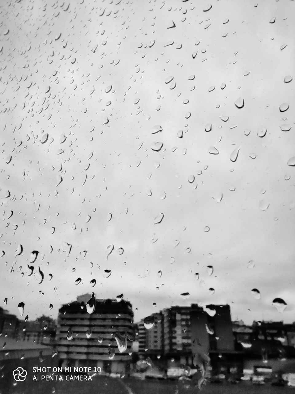 drop, wet, water, rain, building exterior, built structure, architecture, glass - material, window, no people, sky, transparent, rainy season, nature, raindrop, building, city, monsoon, outdoors, glass