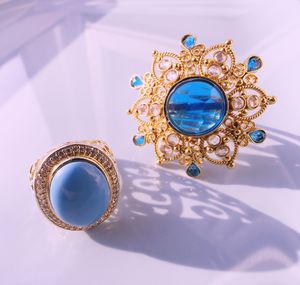 High angle view of blue gemstone jewelries on table