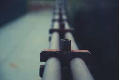 Close-up of rusty nut and bolt on pipe