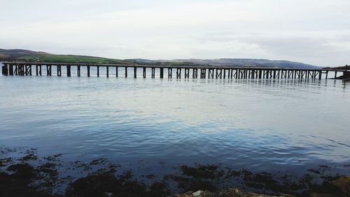 Pier over sea against sky