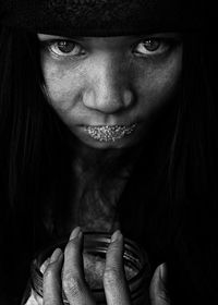 Close-up of girl holding food in jar