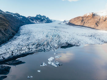 Scenic view of frozen lake against sky