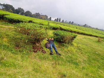 Full length of boy on farm against sky