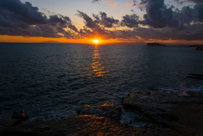 Scenic view of sea against sky during sunset